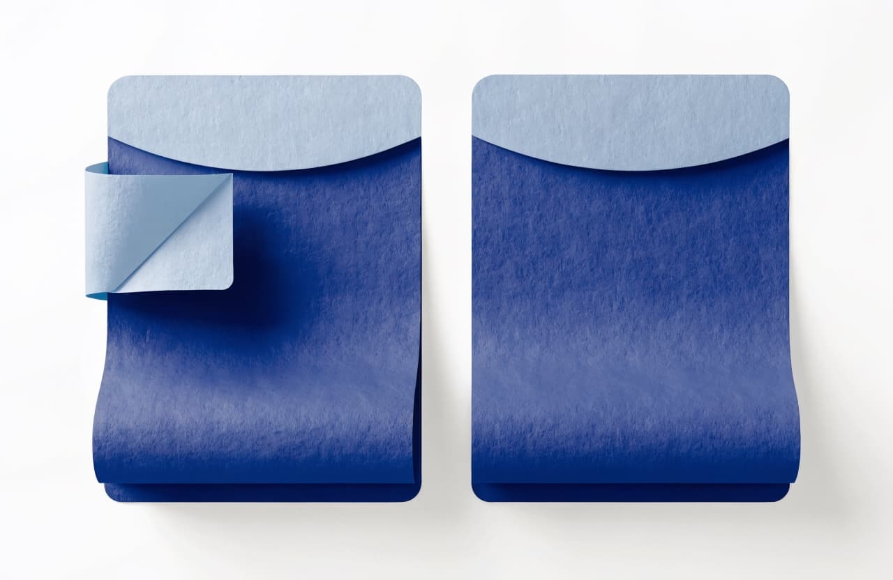 Paper-craft illustration of two nearly identical document pages, one bearing a folded corner badge