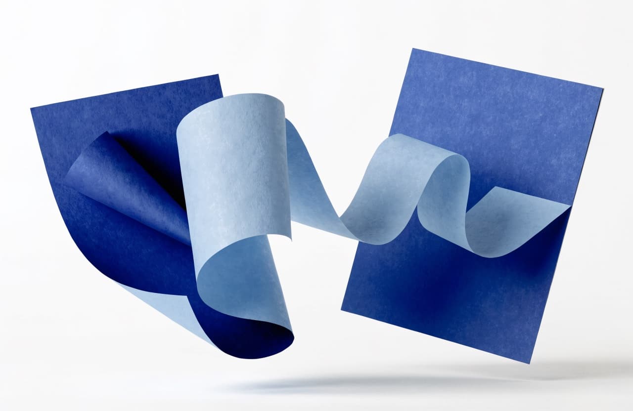 Paper-craft illustration of a photo print becoming a crisp letterhead document page