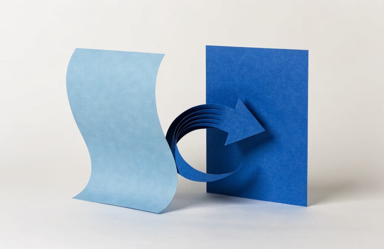 Paper-craft illustration of a faded letterhead page beside a crisp new one with a curved paper arrow